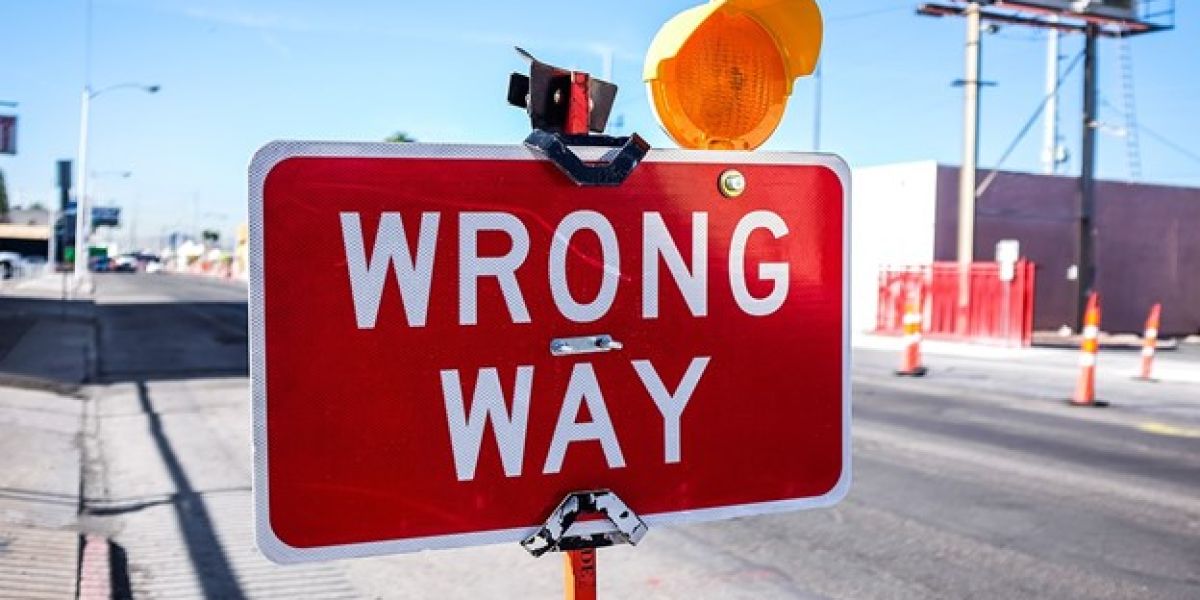 red Wrong Way signage on road