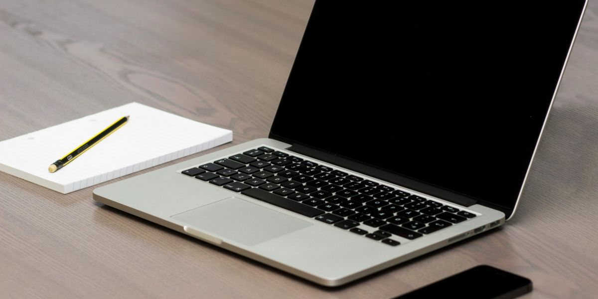 Free Silver Macbook Beside Iphone Stock Photo