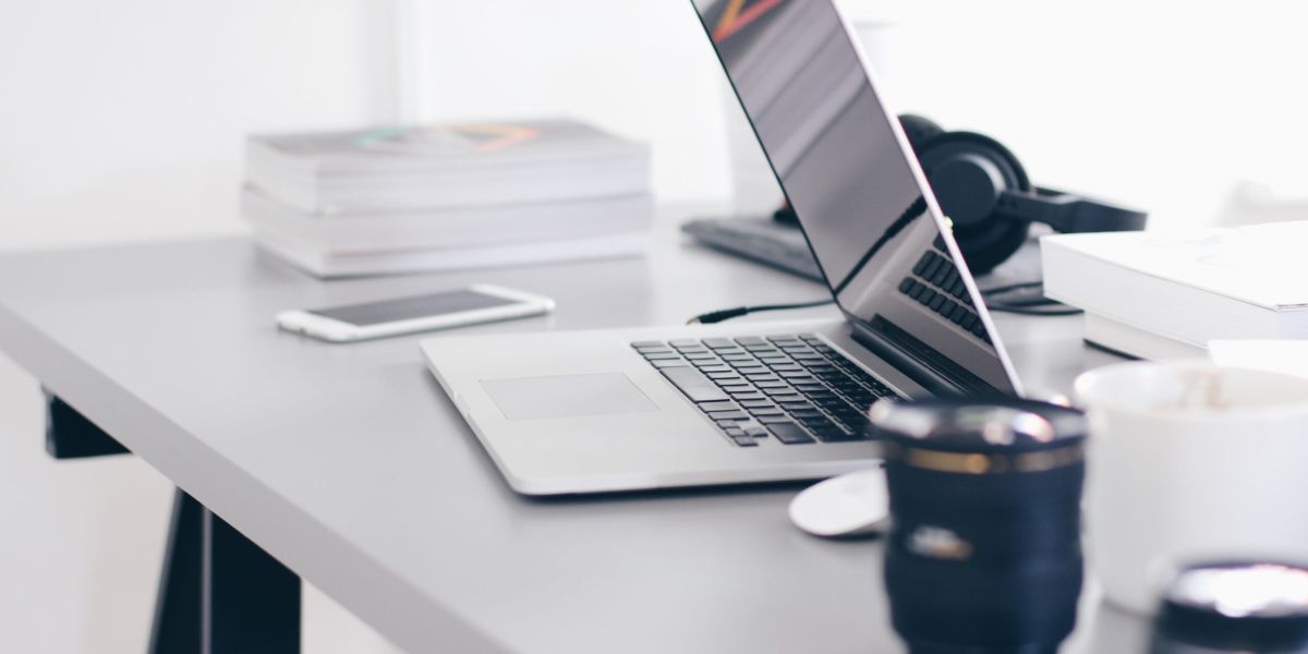 Free Gray Laptop on Table Top Stock Photo