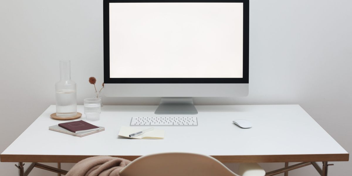 Free Stylish workspace with computer and simple furniture Stock Photo