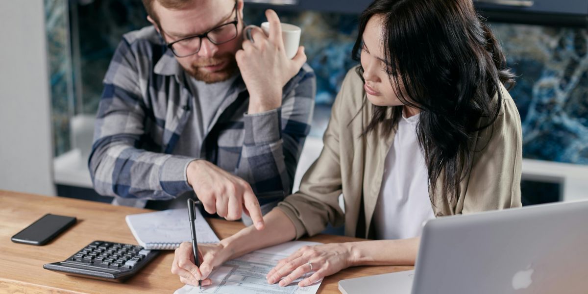 Free couple calculating al their bills stock photo